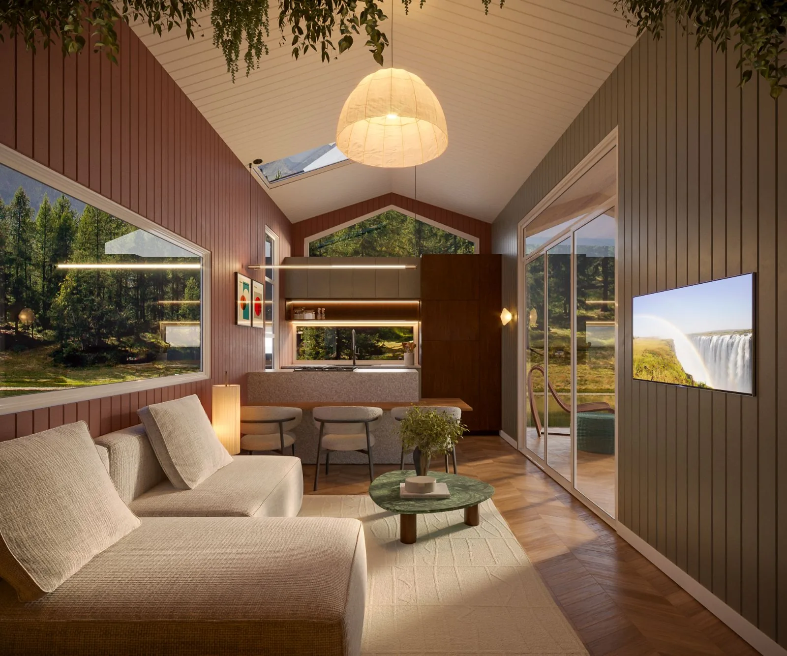 Ember living room at golden hour, looking through to the island kitchen and out to the trees